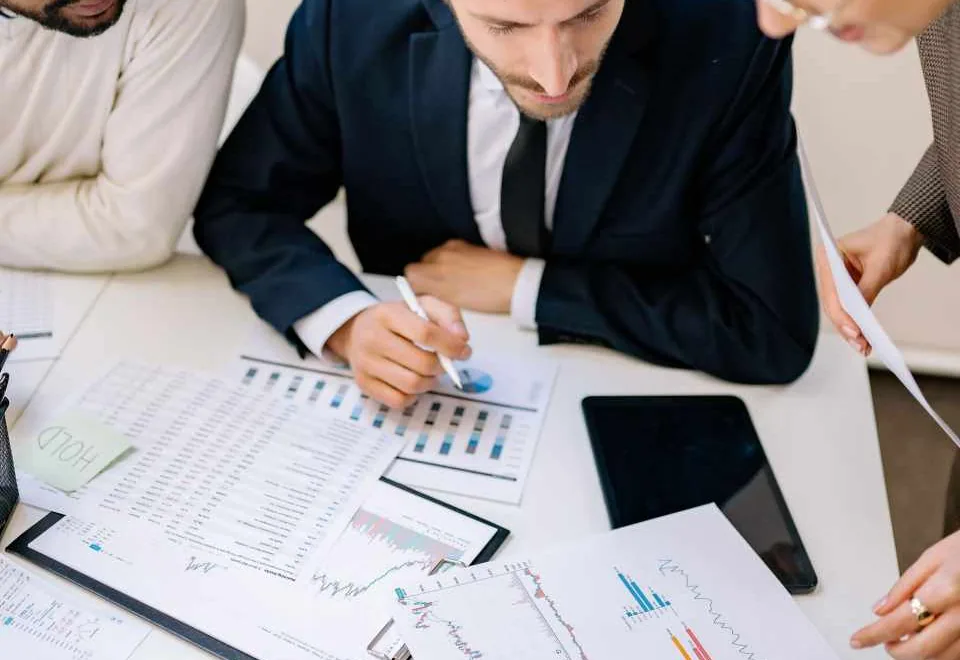 Business team reviewing financial records and documents